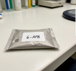 Buy Pure 6-APB Canada – 99.9% high-purity 6-APB HCl crystal in sealed ChemLabs Canada vial, GC-MS/NMR certificate visible, NOC-compliant lab-tested research chemical for Canadian forensic buyers.
